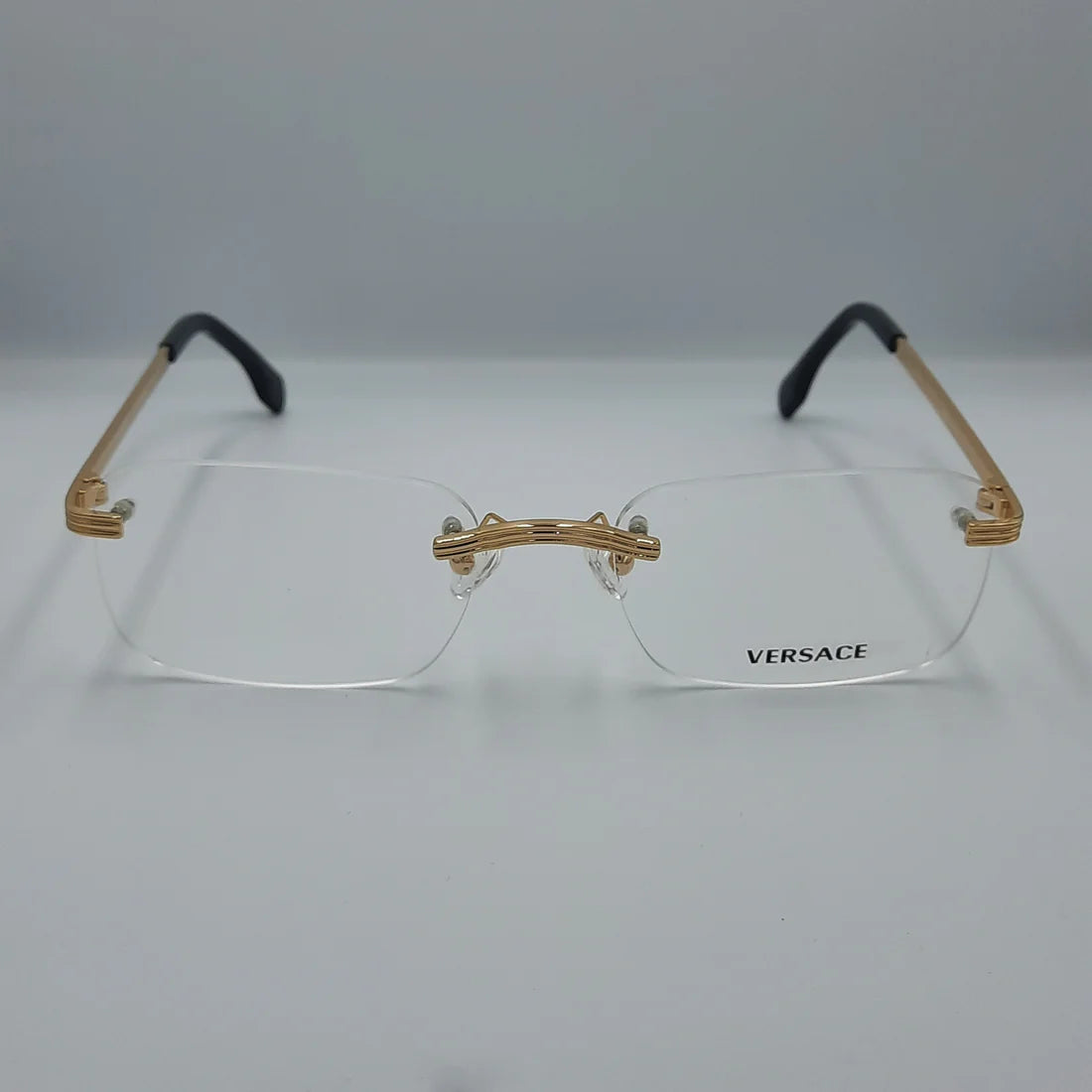Lunette optique percée Versace: doré noir