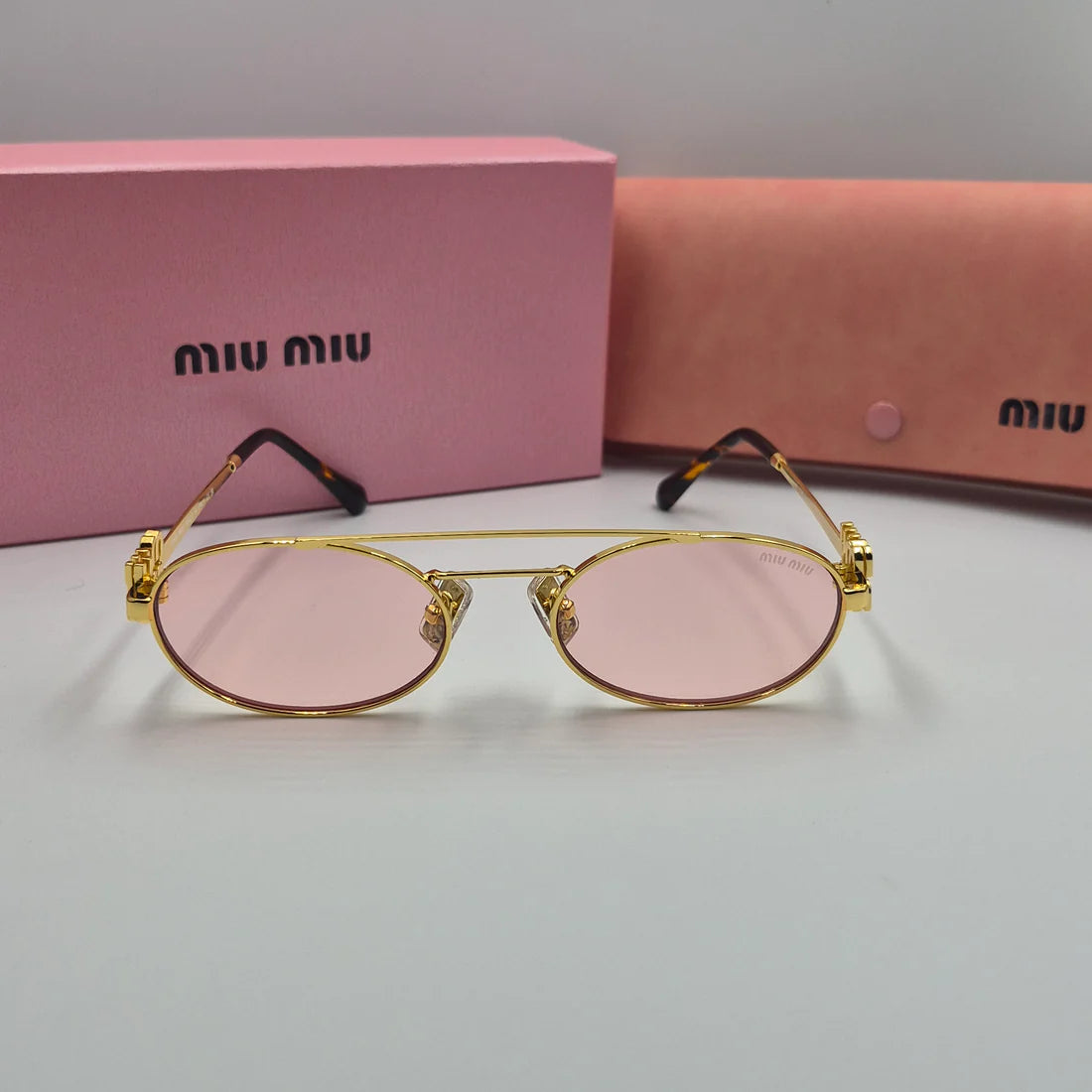 MIUMIU SMU54ZS doré rose saumon