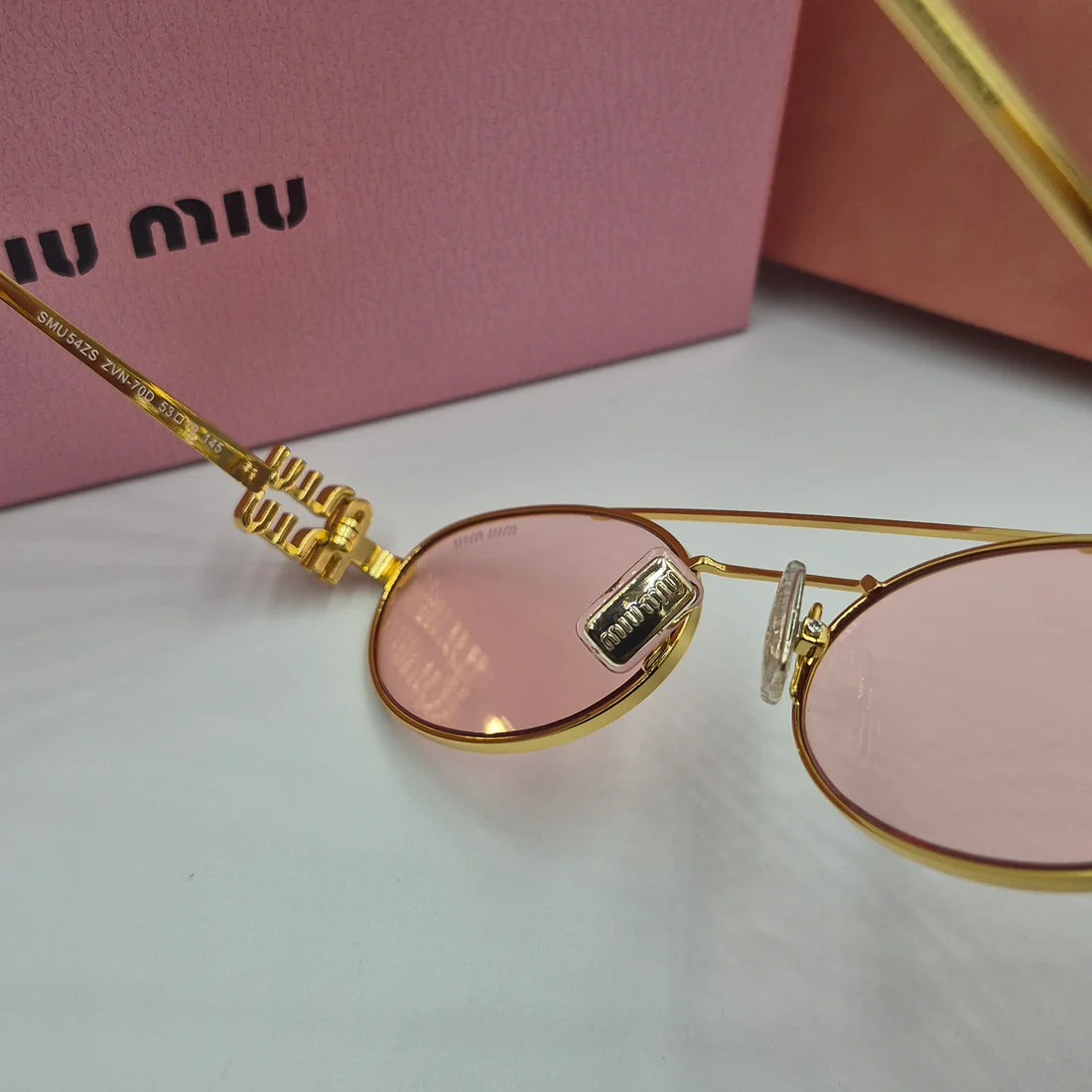 MIUMIU SMU54ZS doré rose saumon