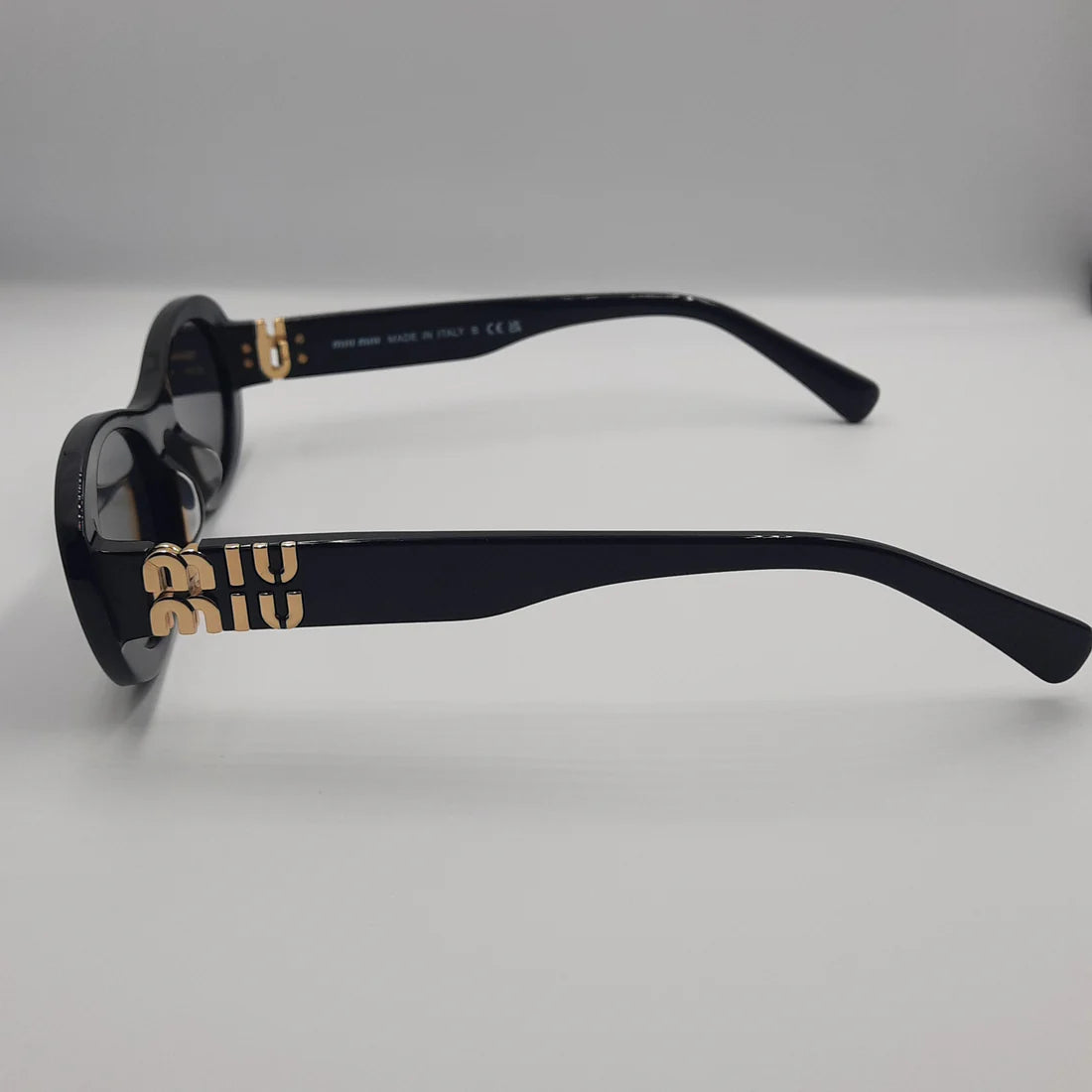 MIUMIU SM06Z Noir/Doré