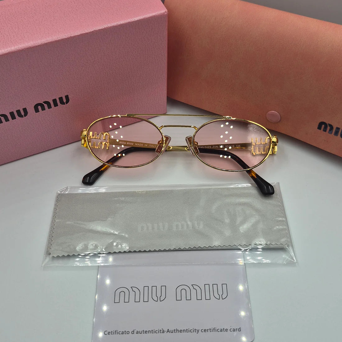MIUMIU SMU54ZS doré rose saumon