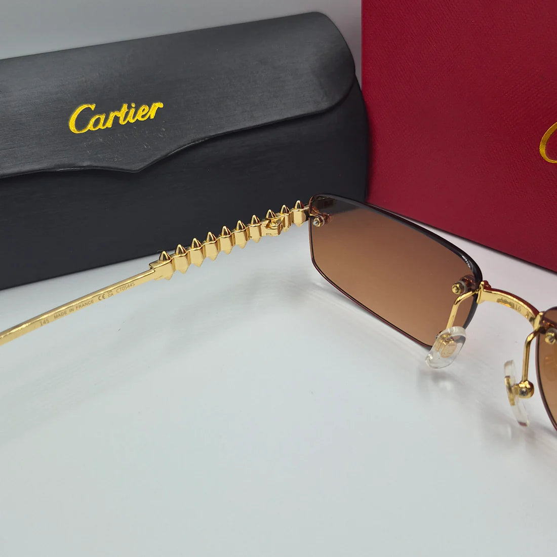 CARTIER CLASH CT0544S doré marron