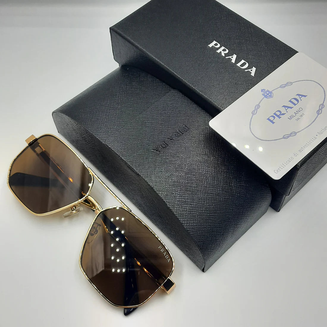 PRADA OPS51ZS rouge doré marron
