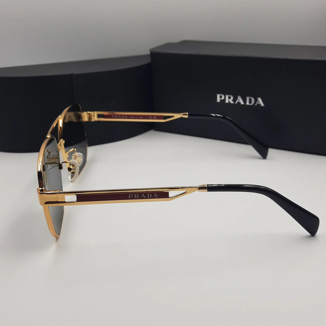 PRADA OPS51ZS rouge doré noir