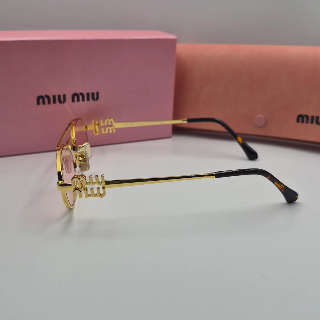 MIUMIU SMU54ZS doré rose saumon