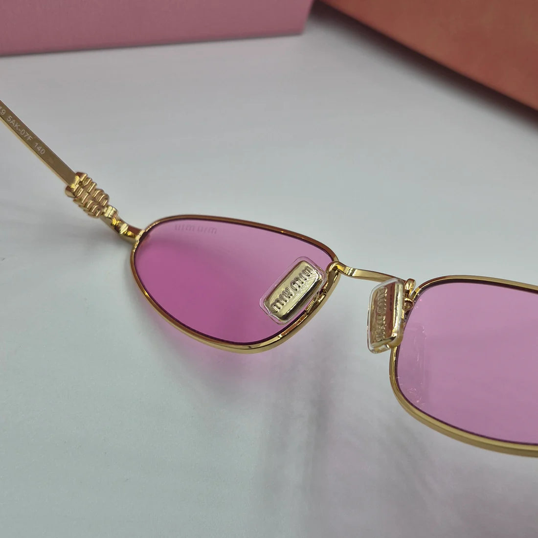 MIUMIU SMU52S doré rose
