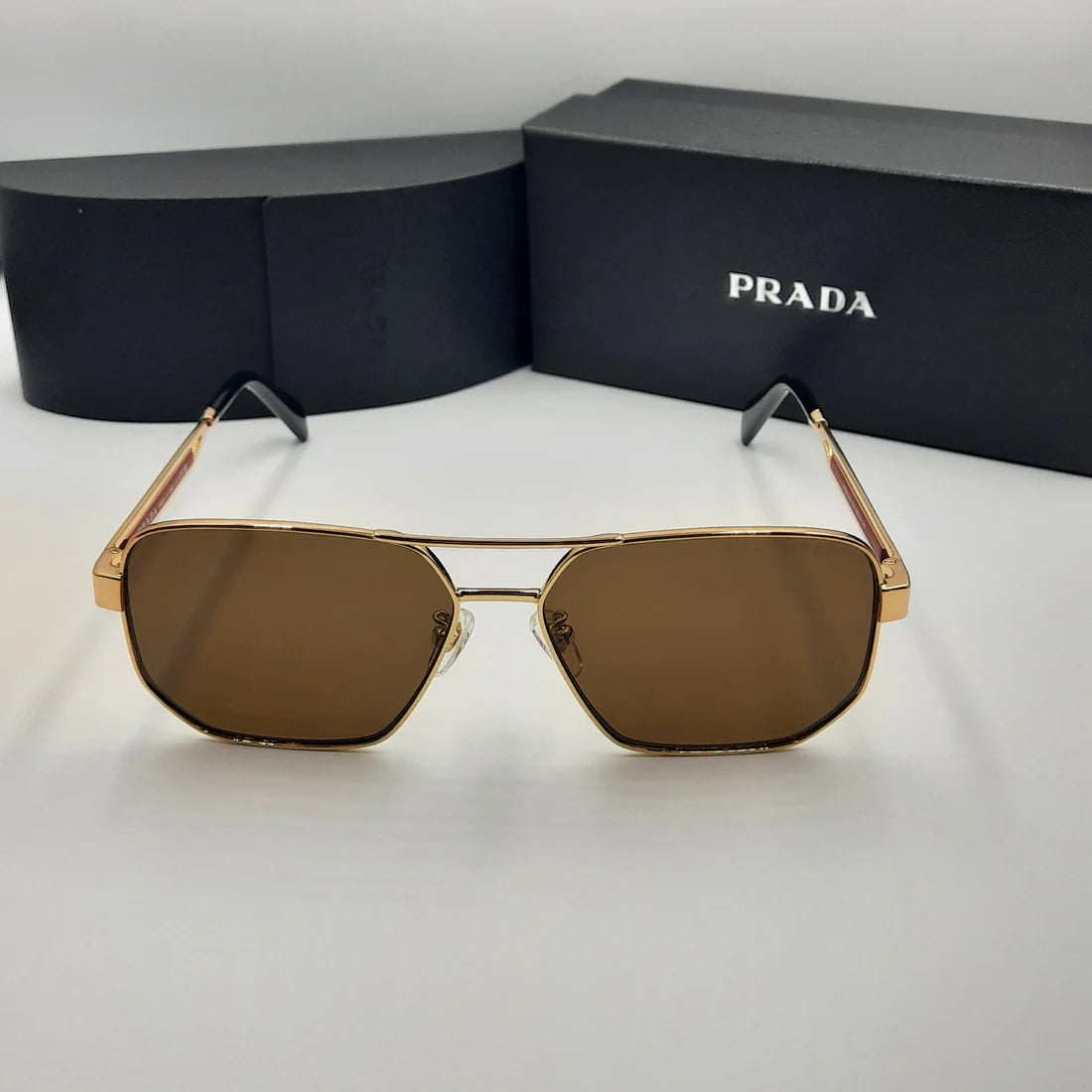 PRADA OPS51ZS rouge doré marron