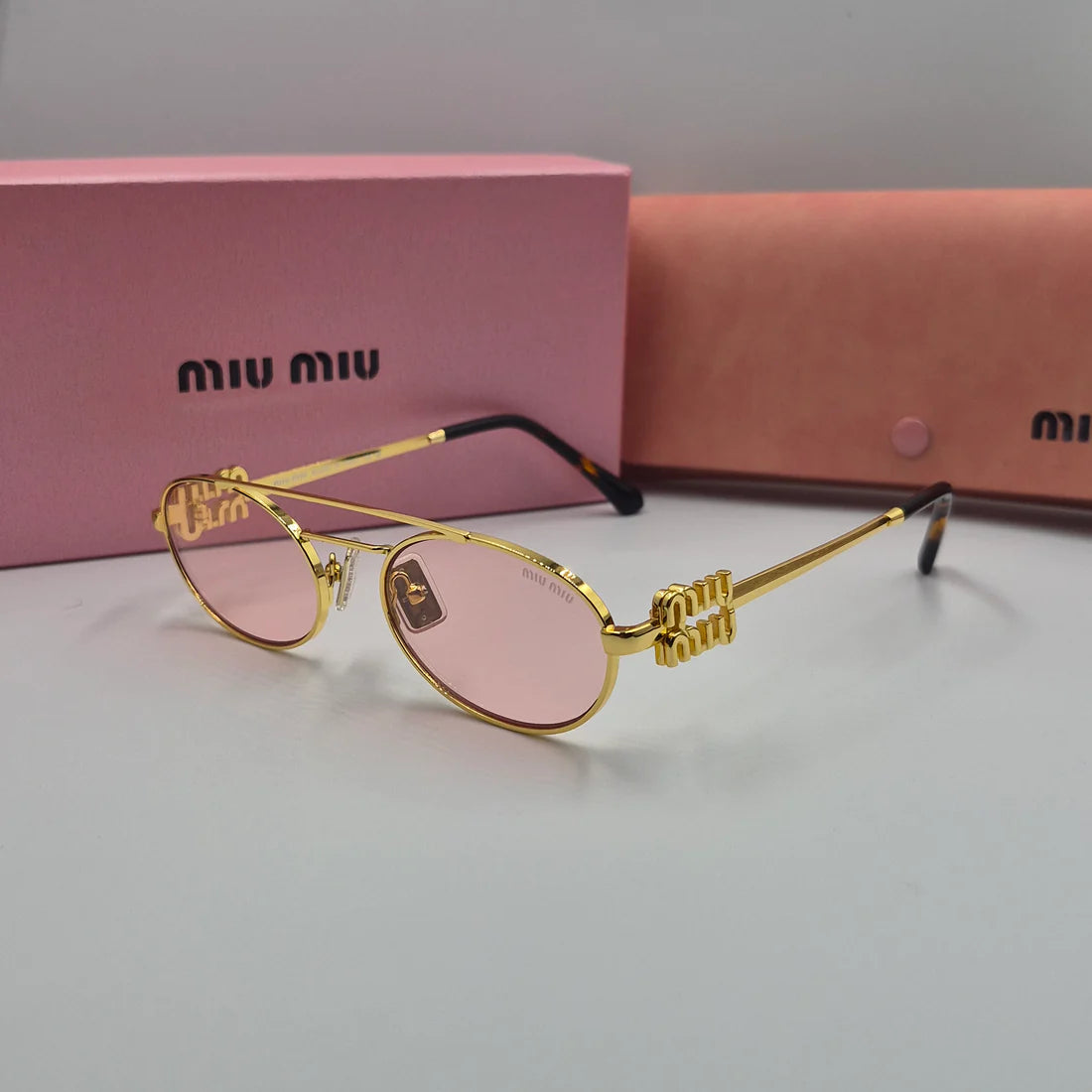 MIUMIU SMU54ZS doré rose saumon